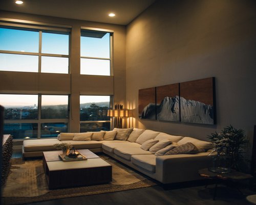 A neat living room setting designed for comfortable evening reading
